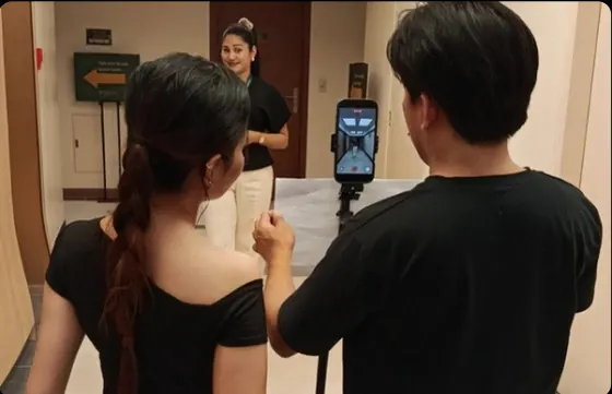 Clickwave social media team in Cavite filming a talking-head video on a phone rig