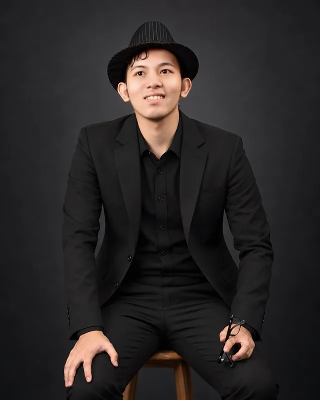 Jovit Ryan Lucero in a black hat and jacket